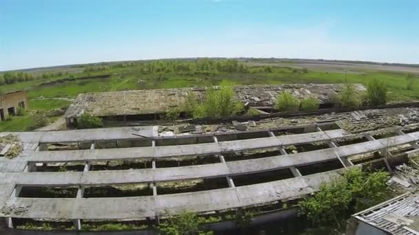 destroyed roof of old rural cowsheds. Aerial - Footage, Video
