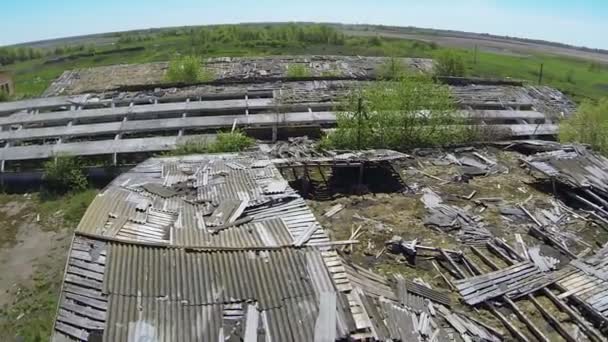 destroyed roof of old rural cowsheds. Aerial view - Footage, Video