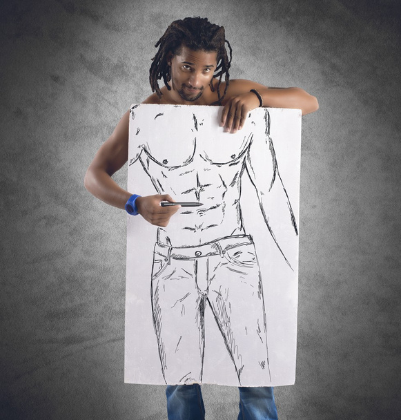 Muscular man draws perfect physique - Photo, Image