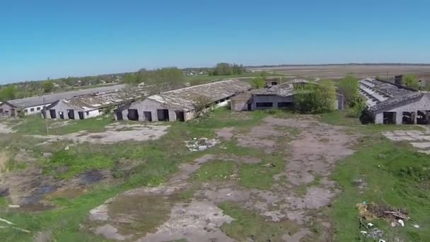Fast flight to  destroyed  rural cowsheds. Aerial view - Footage, Video