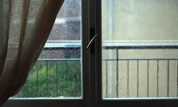 Heavy rain outside the window. Bad weather. - Fotó, kép