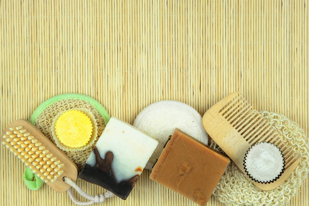 Cosmetics with natural ingredients for body and hair care. Natural handmade cosmetics products on a straw background. Top view. Copy space. - Foto, Imagem