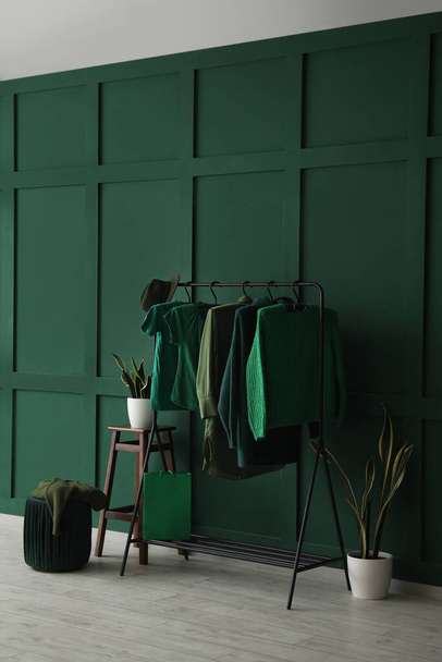 Interior of dressing room with stylish green clothes - Photo, Image