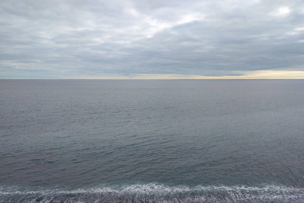 Beautiful views of the Atlantic Ocean and gray skies. The background of nature - Foto, imagen