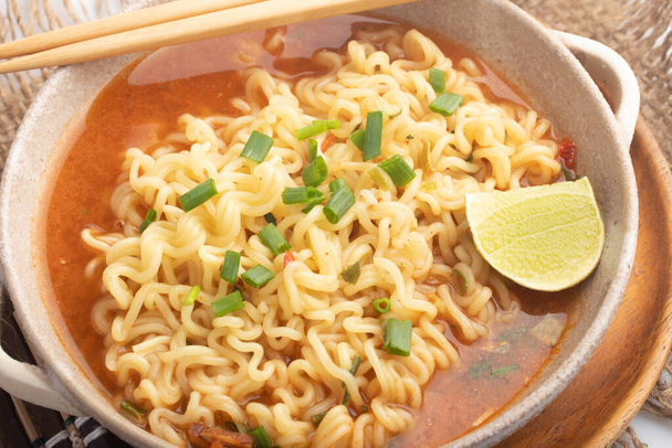 Spicy Korean instant noodles in a cup - Foto, Imagen