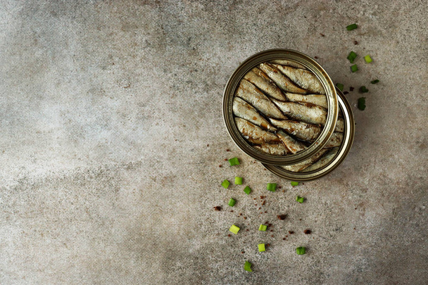 Canned conserves sprats sardines in oil trend food background - Fotó, kép