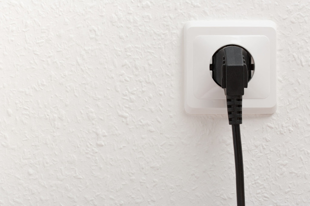 Electric socket with plug - Foto, afbeelding