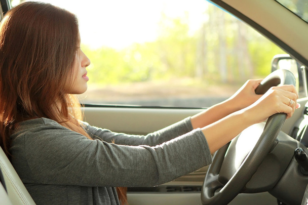 young beauty woman driving a car - Fotó, kép