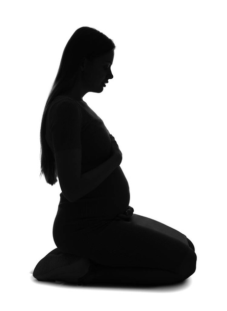 Silhueta de jovem grávida no fundo branco - Foto, Imagem
