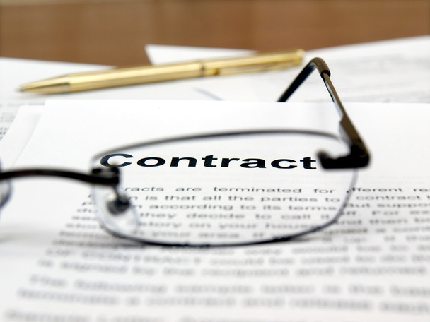 Glasses and pen on the contract papers - Photo, image