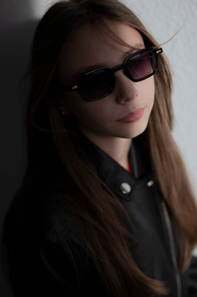 stylish child in leather jacke with glasses  - Foto, afbeelding