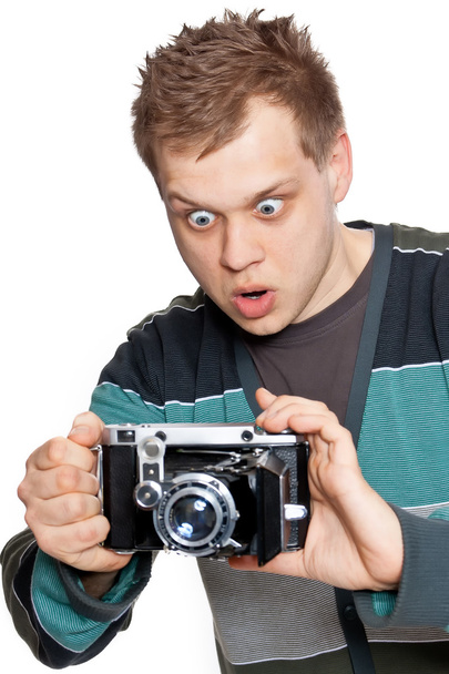 A young man with an antique camera - Foto, immagini