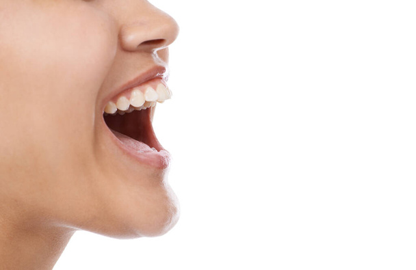 Laughing from her stomach. Closeup of a womans mouth laughing against a white background - Zdjęcie, obraz