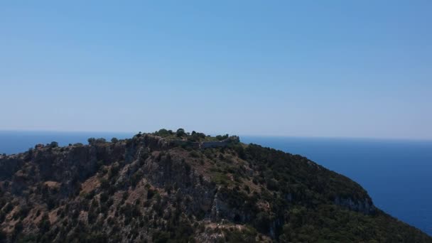 Aerial panorama view over the famous castle of Navarino located on the top of semicircular sandy beach and lagoon, Voidokilia in Messenia, Greece - Filmmaterial, Video