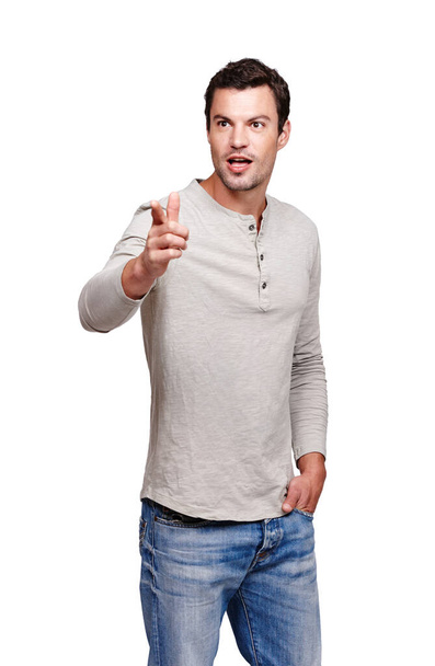 Thinking, confused and man pointing hand in direction with pondering, shocked and surprise expression. Caucasian model thoughtful and pointing to distance with wow look at isolated white background. - Foto, imagen