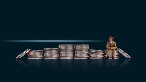 A miniature man sitting on a pile of coins and a heartbeat graphic. Concept of economic crisis management. - Filmagem, Vídeo