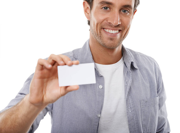 Giving out your business cards. Portrait of a handsome man holding up a business card of copyspace - Zdjęcie, obraz