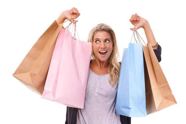Fashion, wow or woman with shopping bag, clothes or luxury products in studio on white background. Excited, retail or happy girl customer with designer brands on sale, discount or promotional offer. - Fotó, kép