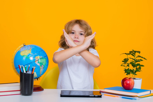 Stop bullying. Sad and angry pupil. School child student learning in class, study english language at school. Elementary school child. Portrait of funny pupil learning - Photo, image