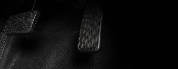 Car accelerate and brake foot pedal. Close up foot press or push foot break and accelerate pedal of a car to drive ahead. Driver driving the car by pressing or pushing accelerator pedals of the car. - Photo, Image