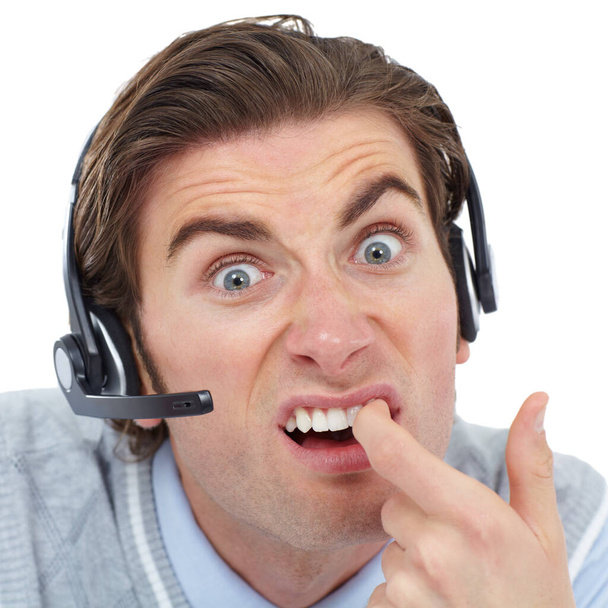 Call center, portrait and consultant clean his teeth, silly and funny face on white background. Face, humor and goofy young man working in crm, telemarketing or customer service job while isolated. - Fotó, kép