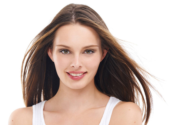 Beauty, hair and portrait of woman in studio for wellness, cleaning and grooming on white background. Haircare, face and girl relax, content and enjoy hair treatment, shine and luxury keratin styling. - Photo, image
