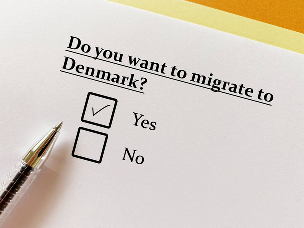 A person is answering question about moving to a new place. He wants to migrate to Denmark. - Fotoğraf, Görsel