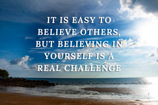 Motivational quotes text - It is easy to believe others, but believing in yourself is a real challenge. With beautiful beach background. - Fotó, kép