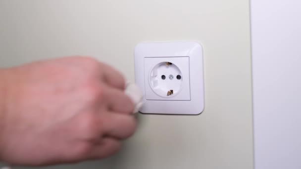 Prevention of fires from the electrical network. Turning off electrical appliances from the electrical outlet in the apartment. 4k video - Materiał filmowy, wideo