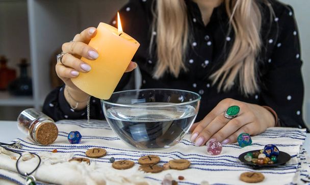 Woman fortune teller fortune telling wax candles. Selective focus. people. - Fotó, kép