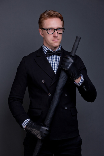 elegant man with a bow and an umbrella - Φωτογραφία, εικόνα