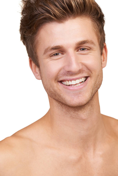 Happy in his own skin. Portrait of a shirtless young man smiling happily - Fotó, kép