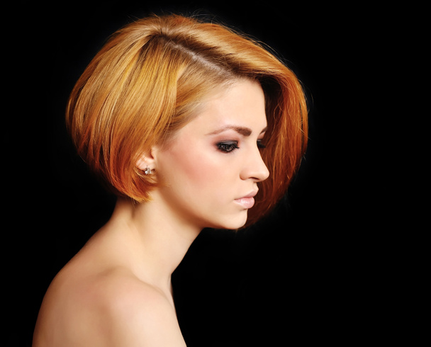 Red hair. Beautiful Woman with Short Hair on a black background. - Photo, Image