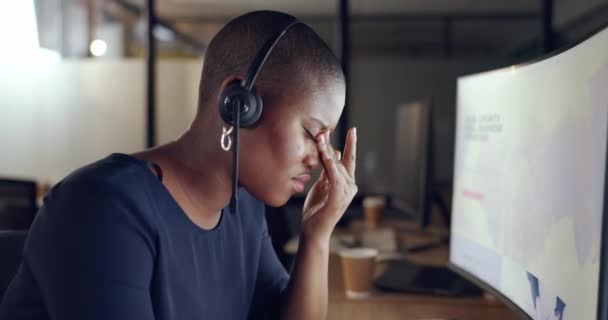 Call center, stress and black woman with headache, burnout and overworked in office, tired and pain. African American female, consultant and agent with depression, crm and overwhelmed in workplace. - Felvétel, videó