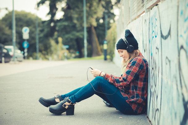 beautiful young blonde hair woman hipster listening music - Photo, Image