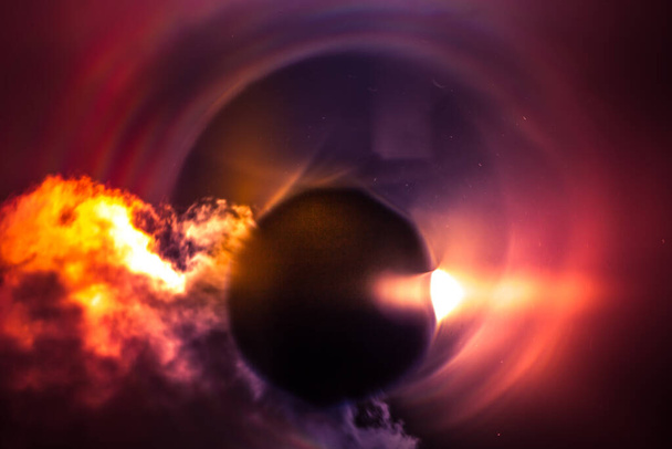 An artistic representation of a partial solar eclipse in beautiful, grainy, colorful manner. - Foto, immagini