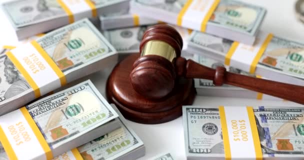 American dollar with judge wooden gavel. Bailiffs debt and financial crimes concept - Metraje, vídeo