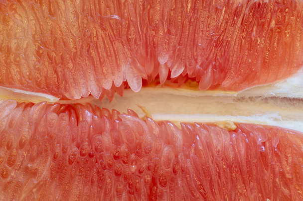 Pink pomelo juice vesicle aggregation. Food background texture closeup - Photo, Image
