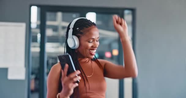 Music, phone and dance with a business black woman walking through her office breakroom while having fun. Relax, radio and energy with a female employee dancing while listening to audio at work. - Felvétel, videó