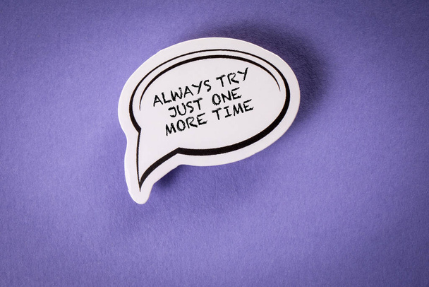Always try just one more time. Speech bubble with text on purple background. - Fotoğraf, Görsel