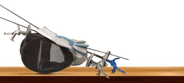 Foil fencing equipment. Three fencing foils with pistol grip (sporting weapon - sword), a fencing mask and a blue and white glove, on a wooden table, isolated on white background.  - Zdjęcie, obraz