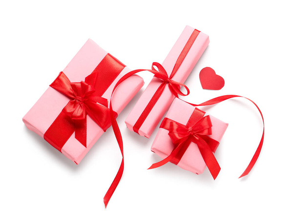 Gift boxes and sequins on white background. Valentine's Day celebration - Zdjęcie, obraz