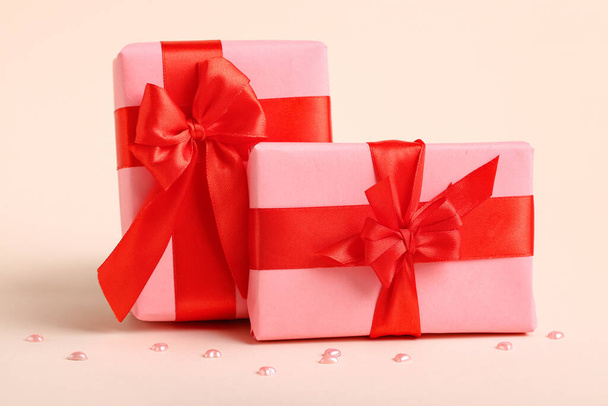 Beautiful gift boxes for Valentine's Day celebration on color background - Foto, afbeelding