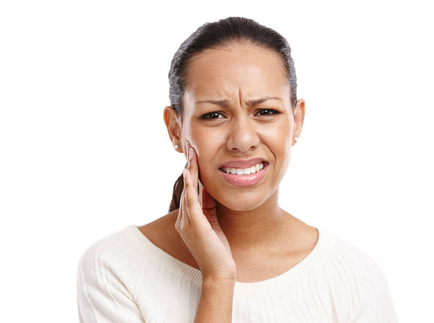 Black woman, face and toothache pain for dental care, mouth injury or medical wellness isolated in white background. African girl, upset portrait and frustrated for teeth accident or emergency. - Fotografie, Obrázek
