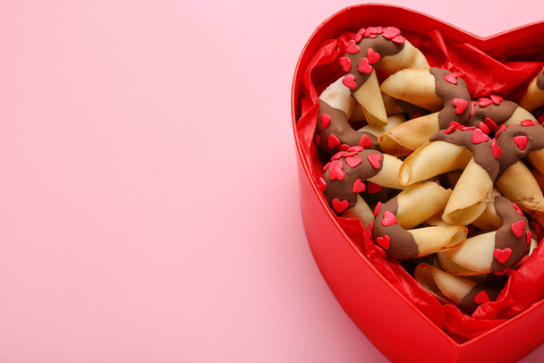 Heart-shaped gift box with fortune cookies on pink background, closeup. Valentine's Day celebration - Foto, Bild