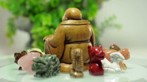Rotating Buddha figurine surrounded 12 animals - Footage, Video