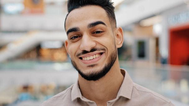 Male portrait close up headshot Indian man bearded Ethnic guy looking at camera smiling flirting adult bearded smile male entrepreneur friendly businessman company CEO boss manager worker indoors - Photo, Image
