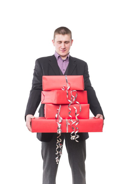 hombre en un traje con cajas de regalo
 - Foto, Imagen