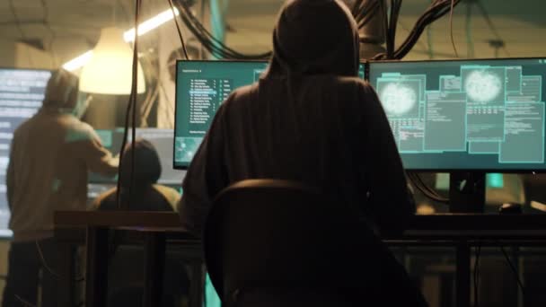 Skilled spy celebrating hacking achievement with security breach, attacking goverment system with encryption. Hacker committing identity theft, cryptojacking ransomware. Handheld shot. - Filmmaterial, Video