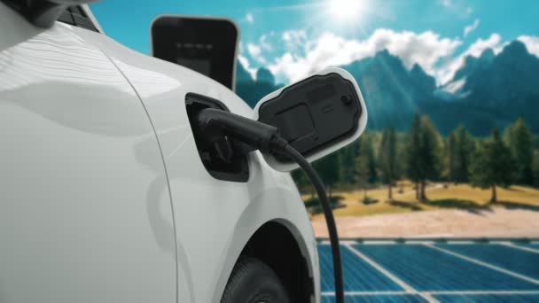 Concept of progressive future renewable and clean energy technology by charging station recharge EV cars battery powered by solar cell for eco-friendly sustainable energy system. - Footage, Video